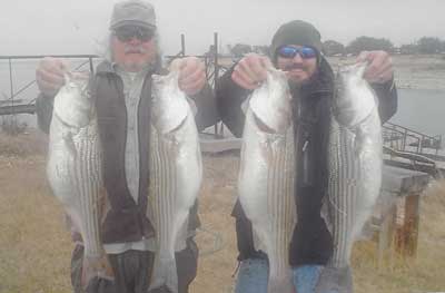 Photo of people with the fish they caught