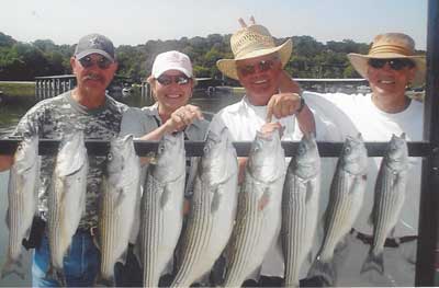 Photo of people with the fish they caught