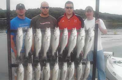 Photo of people with the fish they caught
