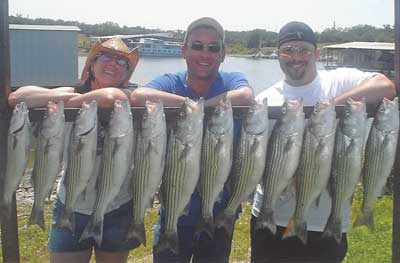 Photo of people with the fish they caught