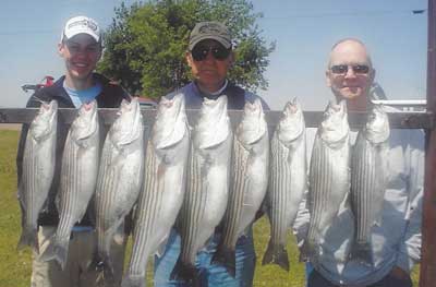 Photo of people with the fish they caught