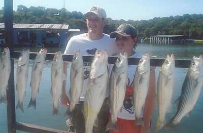 Photo of people with the fish they caught