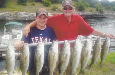 Photo of people with the fish they caught