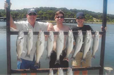 Photo of people with the fish they caught